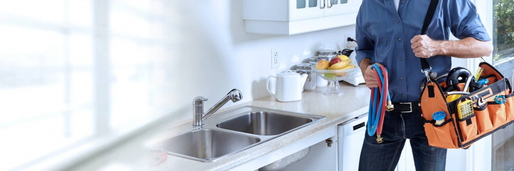 Plumber fixing a sink.