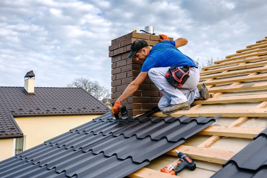 Metal tile roof installation.